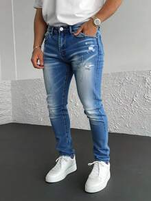 Pantalones vaqueros azules con rotos y efecto envejecido, tiro alto y corte entallado, estilo moderno y casual - Lavado ligero - Ver 1