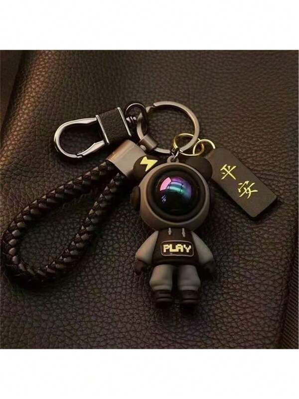 1 Stück süßer Astronaut Silikon Schlüsselanhänger, mit rotem Helm und schwarzem geflochtenen Seil - modisches Accessoire für Frauen, geeignet für Schlüssel, Taschen, Partys & Veranstaltungen - strapazierfähiges Silikon Design, Metallring und 2 Schlüsselringe | Dekoratives Ornament | Exquisite Verarbeitung, für Schulmaterial, Schulanfang