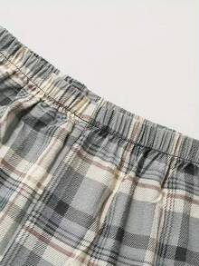 Nowe męskie spodnie w kratę z elastyczną talią i luźnymi spodniami do chodzenia