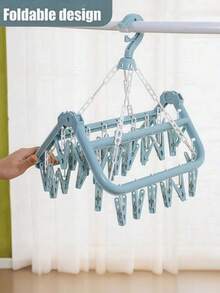 [Economia de espaço] 1 cabide multifuncional, projetado para economizar espaço e comprimir espaço, suporte de armazenamento com 32 clipes, armazenamento, cabide dobrável, secadora multifuncional, clipe de plástico à prova de vento para uso doméstico, cabide com vários clipes de meia, itens domésticos, armazenamento de viagem, cor e estilo aleatórios (PS: É normal que os clipes caiam durante o transporte e não há problemas com a qualidade do produto. Eles podem ser usados após a instalação)