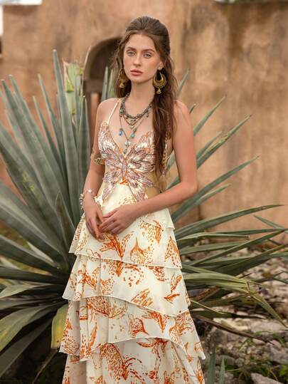 Faeriesty BohoBloom Women's Bohemian Style Spaghetti Strap Maxi Dress, Backless Tie Design, Layered Ruffle A-Line Skirt, Floral & Butterfly Applique Decor. Perfect For Beach Vacation, Casual Outing, Daytime Festival, Seaside Stroll.