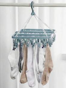 [Economia de espaço] 1 cabide multifuncional, projetado para economizar espaço e comprimir espaço, suporte de armazenamento com 32 clipes, armazenamento, cabide dobrável, secadora multifuncional, clipe de plástico à prova de vento para uso doméstico, cabide com vários clipes de meia, itens domésticos, armazenamento de viagem, cor e estilo aleatórios (PS: É normal que os clipes caiam durante o transporte e não há problemas com a qualidade do produto. Eles podem ser usados após a instalação)