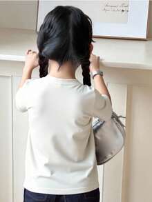 Camiseta de moda para niña. Estampado con letras de PEACE. Suave mezcla con un ajuste cómodo. Top informal. - Blanco - Ver 3
