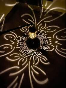 1 Piece Of Retro-Style Metal Lamp With Hollowed-Out Leaf Patterns And Solar-Powered Function, Named "Solar Leaf Pattern Ambiance Lamp" With A Decorative Theme. It Is Suitable For Courtyards, Terraces, Gardens, And Foyers.