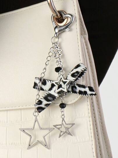 Um novo estilo popular do estilo INS Y2K, estilo coreano doce, requintado, doce, legal, doce coreano, luxo , fofo, moda requintada, moda do amor Corrente de prata, pingente de chaveiro com estrela oca, estampa de leopardo, laço, pingente de chaveiro DIY, pingente de chaveiro de cor sólida de liga de zinco, adequado para namoro, campus, lembrança, decoração de festa, acessórios de bolsa, cordões com suporte de identificação, acessórios de carro, encantos de bolsa, presente de Natal