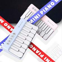 1 件 7 色灯光迷你钢琴，22 键多功能袖珍钢琴，便携式儿童音乐玩具，适合 3 岁以上男孩和女孩，生日/万圣节创意礼物（不含电池） - 彩色 - 查看 3