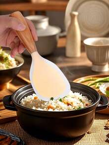 1 ملعقة أرز من السيليكون، خالية من الروائح وصديقة للبيئة. مقبض خشبي فاخر. أنيقة وقوية، مقاومة للحرارة. ملعقة أرز دوارة، ملعقة أرز لا تلتصق، ملعقة أرز قائمة، ملعقة تقديم ذات مقبض خشبي. مناسبة لجميع أنواع طناجر الأرز والمكونات، لا تلتصق، سهلة التنظيف.