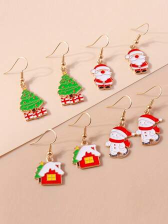 1 par örhängen med julsnögubbe, jultomte, julgran och snöhus för kvinnor