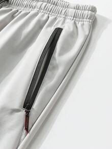 男士冬季休闲运动保暖长裤，腰部抽绳设计，两侧带拉链口袋。适合居家、跑步、运动等场合。 - 淺灰色 - 查看 4