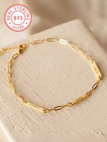 A Custom-Made 925 Silver Bracelet With A Minimalist Rectangular Nameplate And A Paperclip Chain, Capable Of Engraving 1-3 English Names. This Creative And Surprising Gift Is Perfect For Loved Ones, Friends, And Family. It Makes An Excellent Gift For Mother's Day, Valentine's Day, Birthdays, Anniversaries, Graduations, And Christmas. - Yellow Gold - View 4