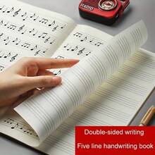 1本乐谱笔记本 - 宽行距钢琴乐谱，40页/20张，标准五线谱，大方格和超宽音符 - 黄色封面乐谱本，适合初学者、学生、音乐家，钢琴主题礼物，钢琴配件，课堂笔记本，易于书写，适用于乐器配件、乐队、音乐教育、课堂用品、音乐家礼物、钢琴礼物、音乐配件。