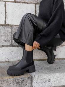 Black Ankle Boots With Thick, Notched Soles – Bold, Contrasting Design - Black - View 1