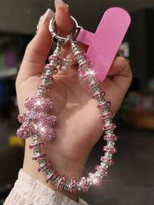 Colgante de llavero con oso/lazo de nudo con strass premium, cadena versátil anti-caída, decoración asimétrica de lazo de perla falsa, adecuado para teléfono, viaje al aire libre, compras, cordón anti-pérdida, correa de funda de teléfono de moda