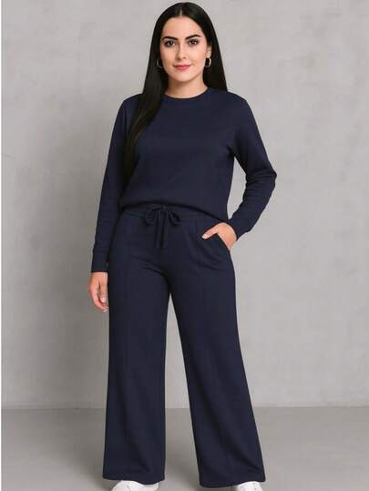 Traje 2 piezas casual de otoño que incluye blusa corta holgada y pantalones pierna ancha tipo pata elefante amplios y cordón en la cintura tela sin transparencias