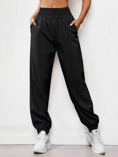 女款弹力腰斜口袋运动裤，黑色