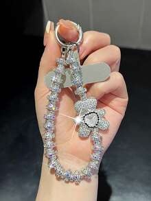 Colgante de llavero con oso/lazo de nudo con strass premium, cadena versátil anti-caída, decoración asimétrica de lazo de perla falsa, adecuado para teléfono, viaje al aire libre, compras, cordón anti-pérdida, correa de funda de teléfono de moda