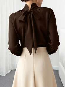 Blusa elegante de unicolor con cuello alto y mangas farol para mujer