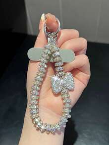 Colgante de llavero con oso/lazo de nudo con strass premium, cadena versátil anti-caída, decoración asimétrica de lazo de perla falsa, adecuado para teléfono, viaje al aire libre, compras, cordón anti-pérdida, correa de funda de teléfono de moda