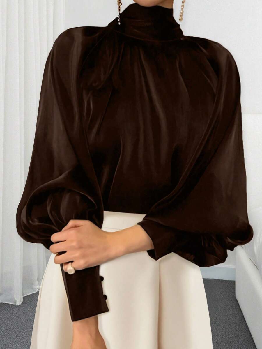 Blusa elegante de unicolor con cuello alto y mangas farol para mujer
