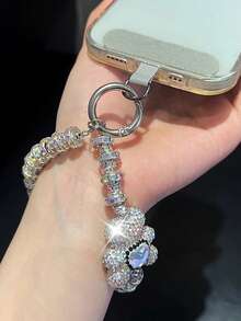 Colgante de llavero con oso/lazo de nudo con strass premium, cadena versátil anti-caída, decoración asimétrica de lazo de perla falsa, adecuado para teléfono, viaje al aire libre, compras, cordón anti-pérdida, correa de funda de teléfono de moda