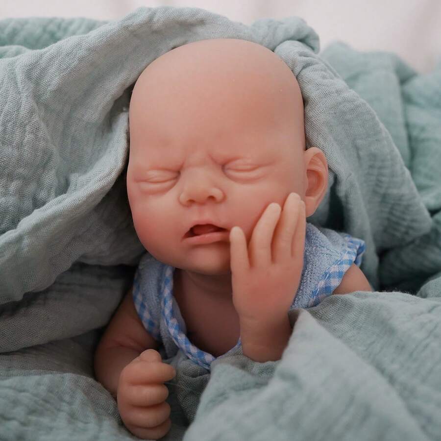 This 12-Inch Reborn Doll Is A Cute Baby Boy Wearing A Blue Fish Pattern Outfit, With Eyes Closed, Can Be Bathed, Soft And Realistic Touch, Made Of Silicone Material, An Ideal Children's Birthday Gift, Collectible Toy, And Halloween/Christmas Gift. - Blue - View 1