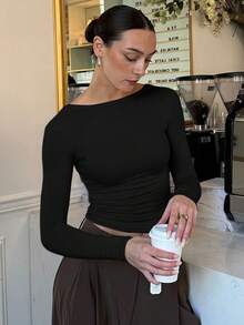 Nowy seksowny, dopasowany top z odkrytymi plecami i długim rękawem w jednolitym kolorze