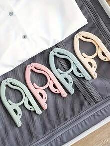 10/5/1 pieza Percha de ropa plegable y portátil para viajes - Diseño plegable que ahorra espacio, percha de plástico de varios colores, adecuada para equipaje, organización de armarios y esencial para viajes, ligera y fácil de plegar. Accesorio indispensable para cruceros, tendedero plegable que ahorra espacio, percha de ropa, estante de ropa para viajes (color aleatorio) Artículos esenciales para viajes, accesorios de viaje, vacaciones, verano, vuelta al colegio