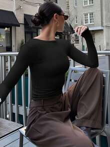 Nowy seksowny, dopasowany top z odkrytymi plecami i długim rękawem w jednolitym kolorze