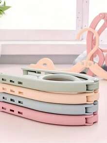 10/5/1 pieza Percha de ropa plegable y portátil para viajes - Diseño plegable que ahorra espacio, percha de plástico de varios colores, adecuada para equipaje, organización de armarios y esencial para viajes, ligera y fácil de plegar. Accesorio indispensable para cruceros, tendedero plegable que ahorra espacio, percha de ropa, estante de ropa para viajes (color aleatorio) Artículos esenciales para viajes, accesorios de viaje, vacaciones, verano, vuelta al colegio