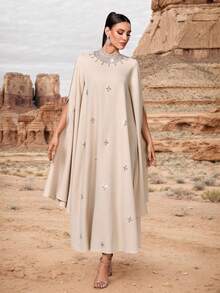 Đầm maxi nữ cổ đứng màu trơn, đính đá và ngọc trai giả cầu kỳ, cổ áo trang trí bằng ngọc trai giả, tay áo dài xẻ tà, kiểu dáng thanh lịch, phù hợp cho nhiều dịp và tiệc tùng, kỳ nghỉ xuân. - Màu be - Xem 6