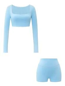 Ensemble de sport décontracté pour femmes avec Top court à manches longues col rond et shorts moulants. Convient pour l'entraînement, la détente et le fitness.