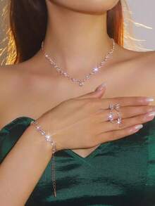 5件套新娘首饰套装：闪亮玫瑰金立方氧化锆项链、1对耳环、手链+单肩包。小巧优雅的女士晚宴包，新娘婚礼贝壳信封包，配有可拆卸金属链肩带。适合女士单肩包、手提包，适用于婚礼、派对、宴会等场合。 - 玫瑰金 - 查看 7