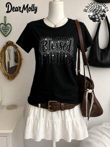 DROGA MOLLY Blessing Koszulka z nadrukiem, luźnym krojem i okrągłym dekoltem, idealna na każdą porę roku jako prezent świąteczny - Czarne - Zobacz 1