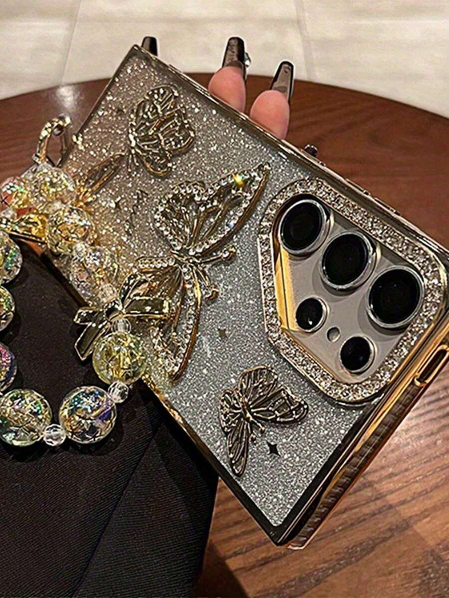 Gradient Glitter Electroplated Rhinestone Lens Butterfly Strap Electroplated Bow Anti-Lost Bracelet Full Coverage Anti-Drop Phone Case Compatible With Iphone 16 Pro Max, 17/17 Pro/17 Pro Max - Champagne - View 1