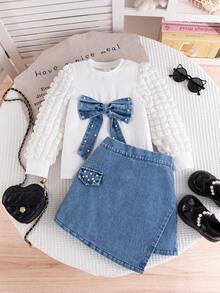 Young Girl Spring/Autumn White Puff Sleeve Round Neck T-Shirt With Bow & Pearl Decor, Paired With Elegant Casual Asymmetric Denim Skirt With Pearl Pocket Flap, 2-Piece Set Suitable For School, Outdoor, Commute, Vacation, Photography, Daily Wear