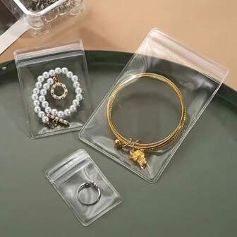 10 PCS Durable Thick PVC Transparent Jewelry Storage Bags - Versatile Gift Wrapping Solutions - Stylish String Packaging Bags - Self-Sealing Plastic Bags For Easy Use - Anti-Oxidation Protection For Your Precious Items - Convenient And Portable Design For Travel And Everyday Use - Perfect For Holidays, Birthdays, And Special Occasions - Ideal For Organizing And Displaying Jewelry, Accessories, And Small Gifts - Enhance Your Gift Presentation With These Functional And Storage Bags