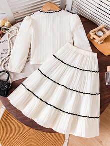 Young Girls Elegant Outfit - Short Puff Sleeve Top Paired With High-Waisted Skirt. The Puff Sleeve Design On The Top Is Playful And Cute, Flattering The Arm Line. The Multi-Layer Skirt Sways Gracefully When Moving. The White Main Color Is Fresh And Refined, With Delicate Black Lace And Floral Accents, And Faux Pearl Elements Adding An Elegant And Sophisticated Touch.