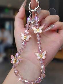 1 pieza Cordón de teléfono de lujo con mariposa, colgante de cristal delicado, correa de muñeca con cuentas hecha a mano, accesorio corto para teléfono