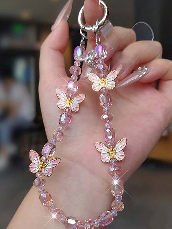1 pieza Cordón de teléfono de lujo con mariposa, colgante de cristal delicado, correa de muñeca con cuentas hecha a mano, accesorio corto para teléfono