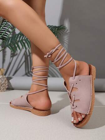 女士粉色系带角斗士凉鞋：镂空设计，平底鞋跟 | 夏季波西米亚风情与海滩度假