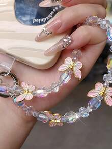 1 pieza Cordón de teléfono de lujo con mariposa, colgante de cristal delicado, correa de muñeca con cuentas hecha a mano, accesorio corto para teléfono