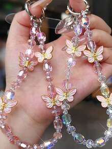1 pieza Cordón de teléfono de lujo con mariposa, colgante de cristal delicado, correa de muñeca con cuentas hecha a mano, accesorio corto para teléfono
