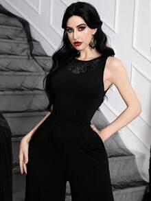 Mono sin mangas de punto negro elegante de estilo gótico de bruja para mujer, con un diseño que cintura la cintura y detalles de panel de malla de terciopelo en la parte delantera.