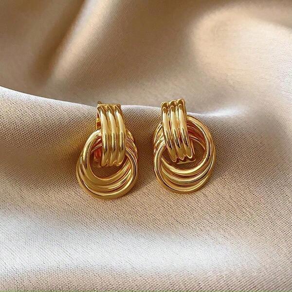 Pendientes circulares irregulares chapados en cobre imitación de oro, diseño de nicho, pendientes de lujo ligero y de alta gama para mujeres