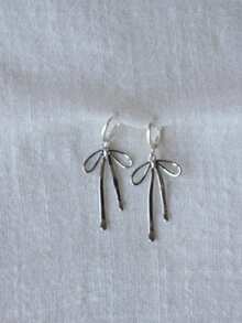 1 par de pendientes largos de lazo elegante en plata, accesorios versátiles para mujeres