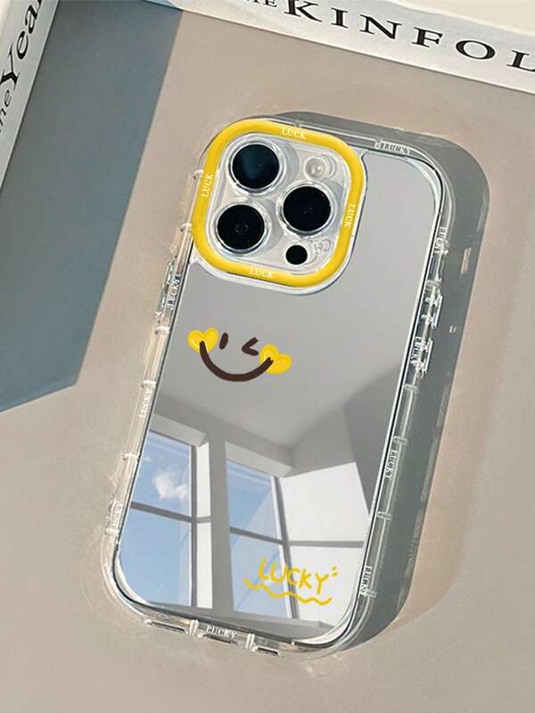 1个黄色爱心笑脸镜面手机壳，创意双层PC硬壳带镜头环，防震，兼容 16/16 Pro/16 Pro Max/16 Plus/15/14/13/12/11/16E，也兼容 17/17 Pro/17 Air/17 Pro Max