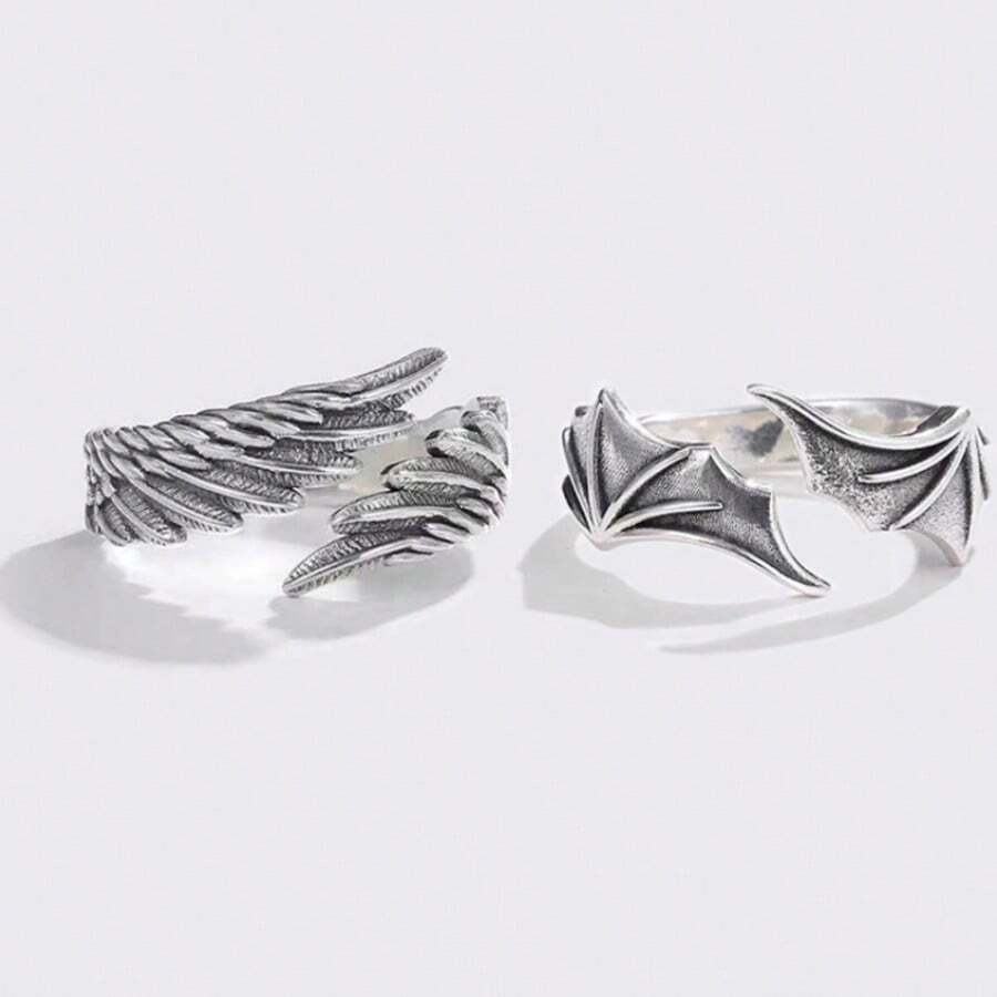 Thai Silver Pair Rings: Angel's Wings Encounter Demon's Wings With The Tenderness Of Angel Wings On One Half And The Sleek Aura Of Demon Wings On The Other, They Inscribe Your One-Of-A-Kind Tie And Unlock A Novel Way To Convey Love.