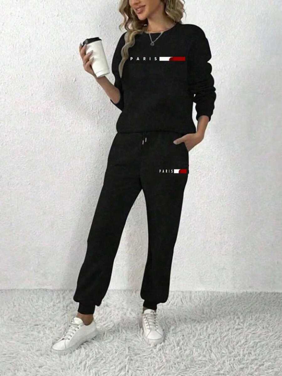 两件套时尚优雅简约圆领卫衣套装，适合秋冬季节穿着。加厚抓绒面料，低弹力，无弹力设计。圆领上衣搭配抽绳长裤，时尚巴黎印花图案，适合休闲、运动和居家日常穿着。 - 黑色 - 查看 1