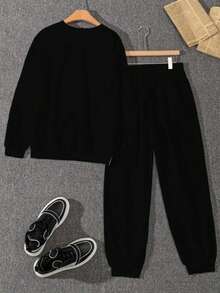 The Stylish And Elegant Simple Round Neck Pullover Sweatshirt Two Pieces Set For Autumn And Winter Features A Thick Flannel Style. The Round Neck Top Is Paired With Drawstring Pants, Showcasing A Fashionable Large Graphic Letter Combination Print Design. It Is Very Suitable For Casual Sports, Fitness Training, Outdoor Jogging, And Daily Wear At Home.