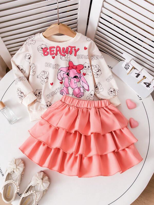 Young Girl' Playful Cartoon Rabbit Print Set: Includes A White Sweatshirt With All-Over Cartoon Rabbit And "BEAUTY" Letter Print, Paired With A Pink Multi-Layer Ruffle Skirt. Lively And Cute, Suitable For Kindergarten Activities, Weekend Outings, Spring/Autumn/Winter.
